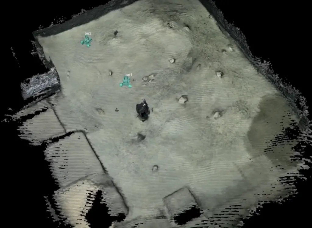 A shared 3D reconstruction built from the views of multiple rovers